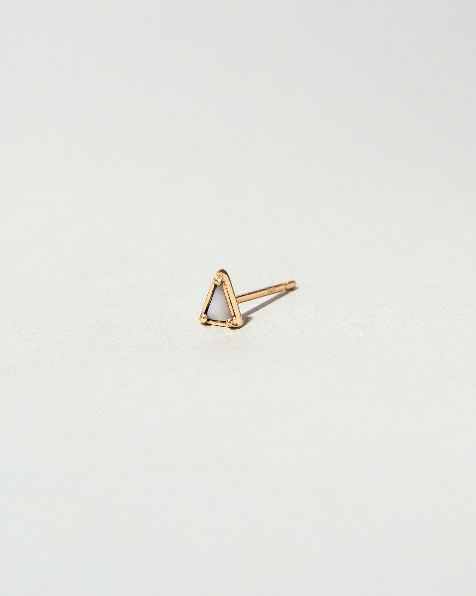 Gold Agate Triangle Stud Earring Single on light color background.