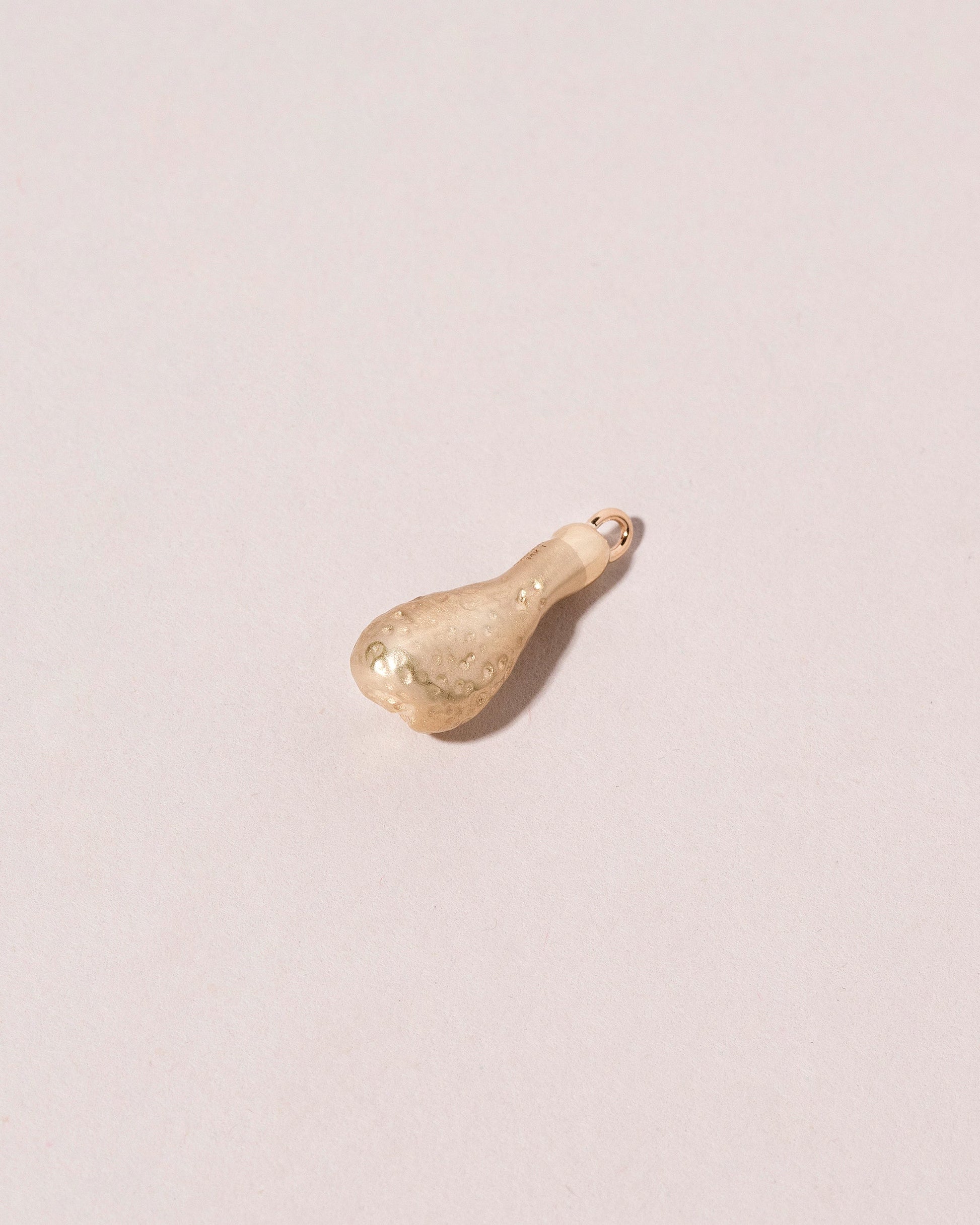  Chicken Drumstick Charm on light color background.