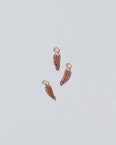 Chili Pepper Charm - Pavés on light color background.