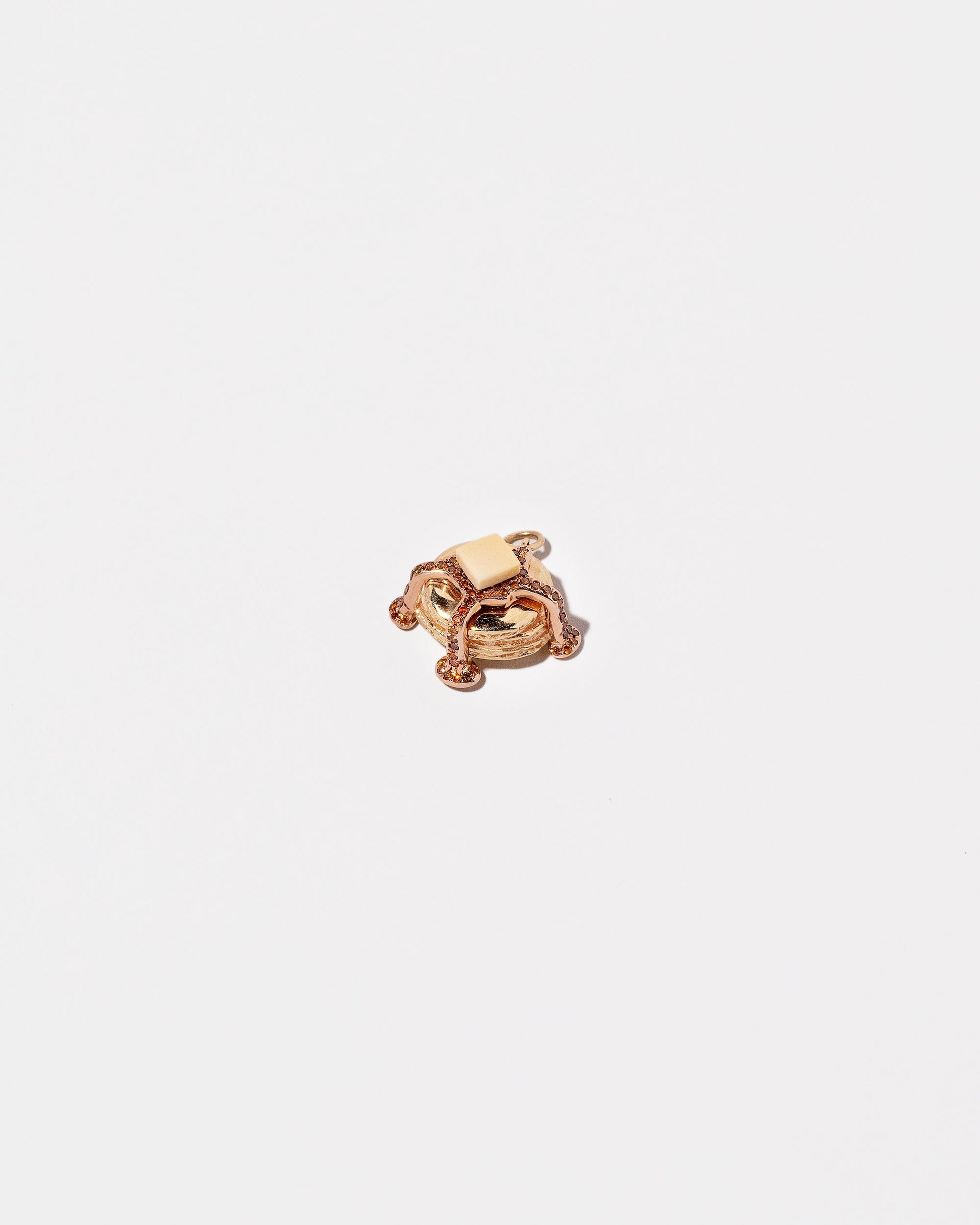 Closeup details of the Tall Stack Pancake Charm on light color background.