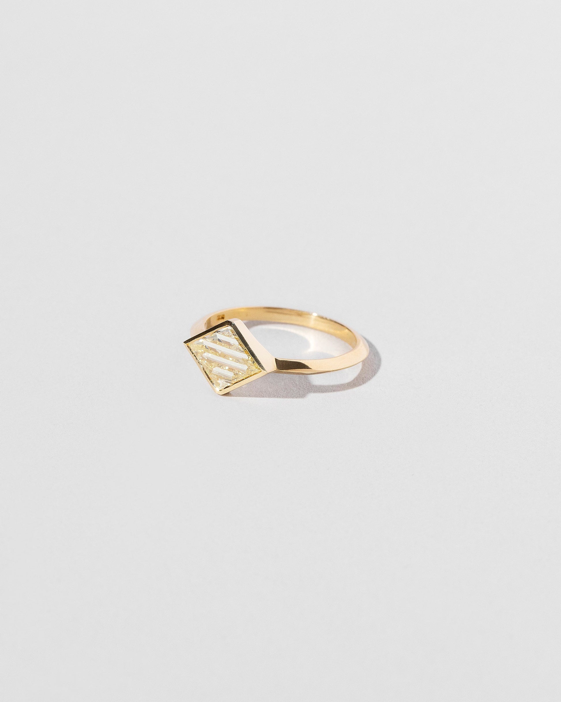 View from the side of the Aidos Ring on light color background.