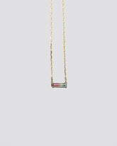  Kiss Me Necklace on light color background.